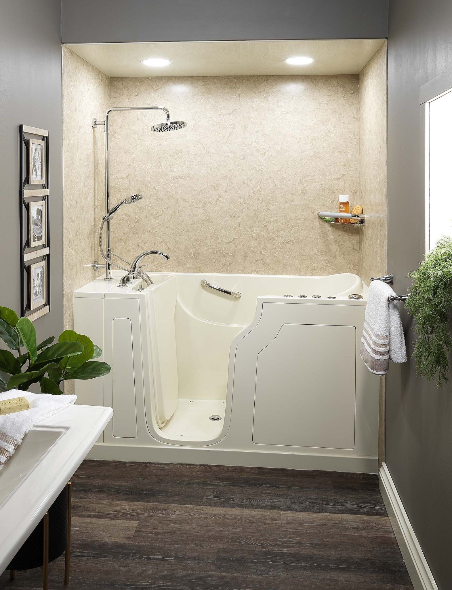a bathroom with a walk in tub and a shower .