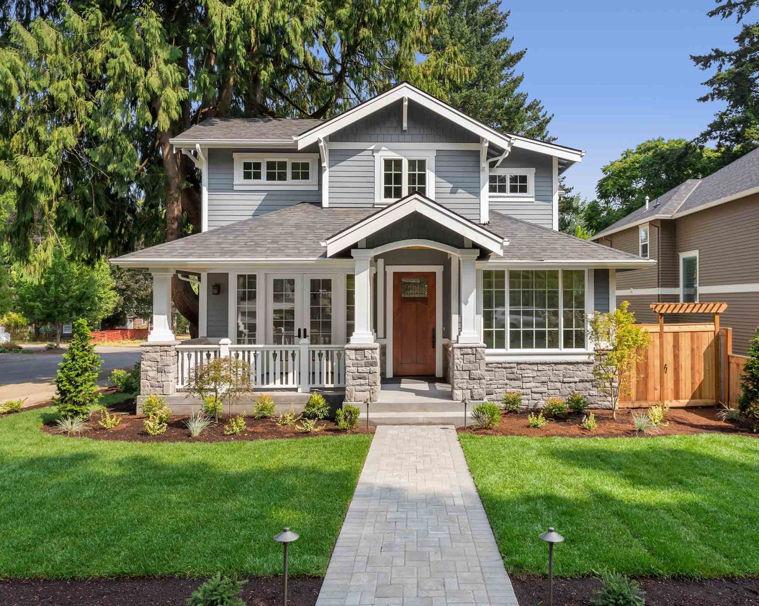a large house with a large lawn in front of it .