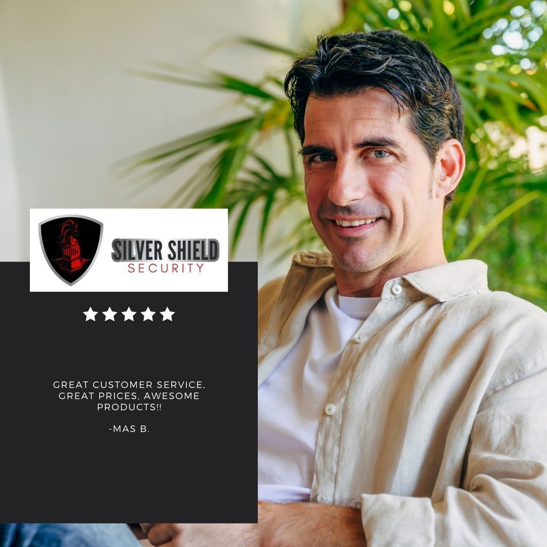 Silver Shield Security logo beside a smiling man in a light shirt, standing indoors with plants.