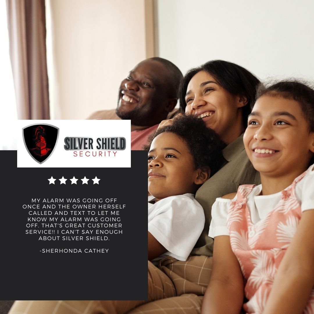 Family smiling on a couch beside a Silver Shield Security ad with shield logo and star rating