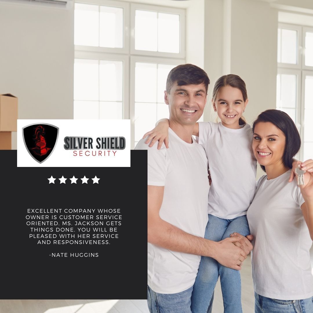 Silver Shield Security logo beside a smiling family in a bright home interior