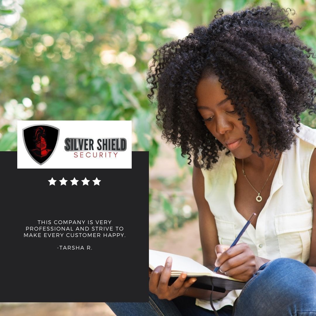 Woman writing in a notebook beside a Silver Shield Security logo and star rating.