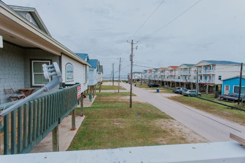A view of a row of houses from a balcony.