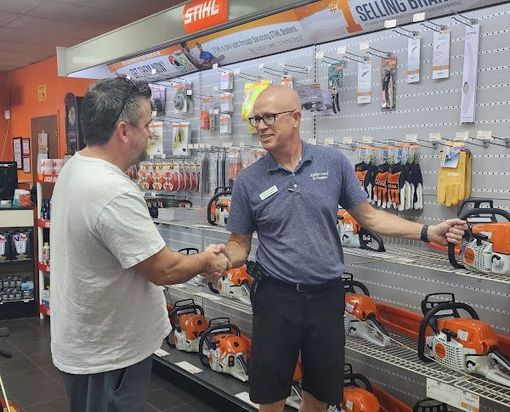 Eric Owens helping customer with Stihl Chainsaw