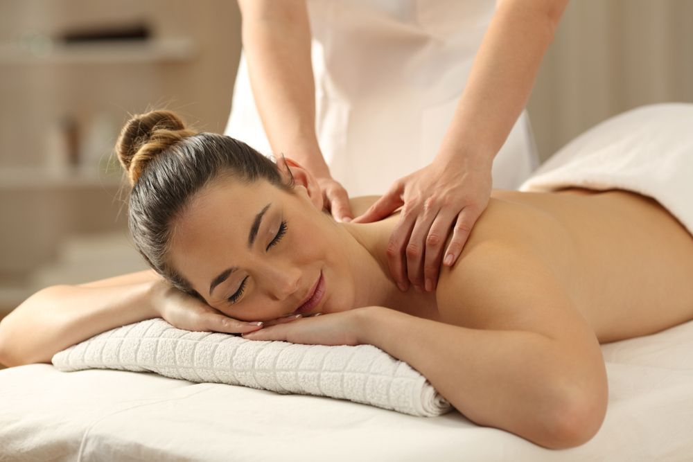 A Woman is Getting a Massage at a Spa — Erikka's All Occasion Beauty In Rockhampton City, QLD