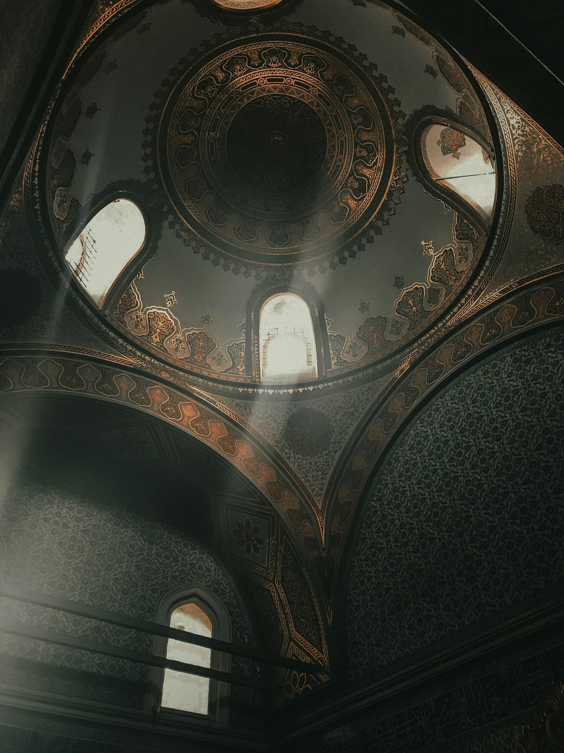 Looking up at the dome of a building with a lot of windows