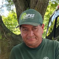 Man wearing green hat and shirt, with 