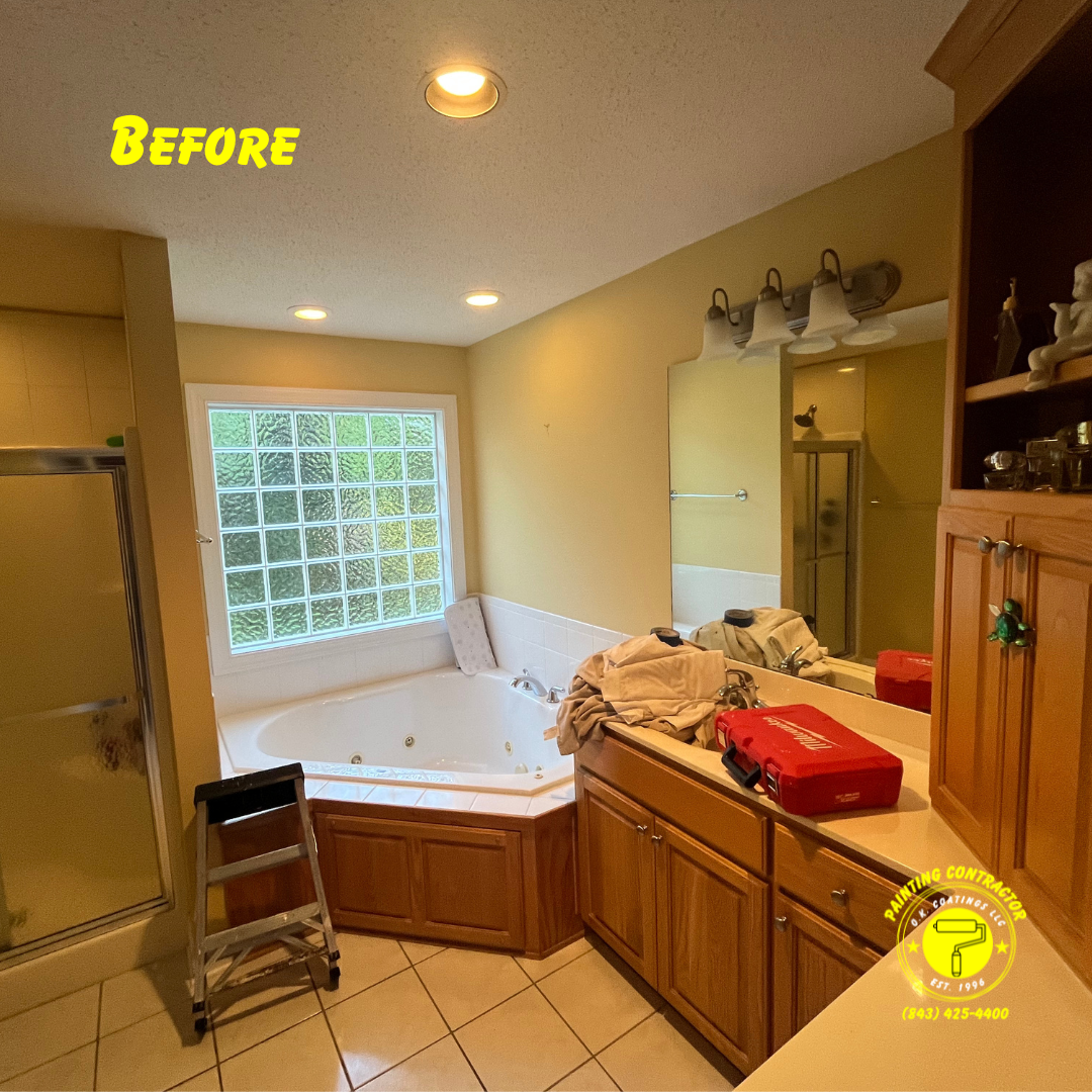 A bathroom with honey oak cabinets, a corner jetted tub, a glass block window, and a step stool, labeled 