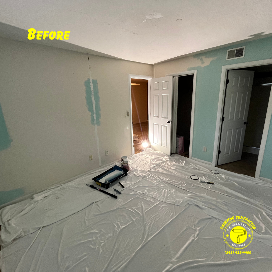 A room interior with partially painted light green walls, a plastic drop cloth on the floor, and a paint tray.