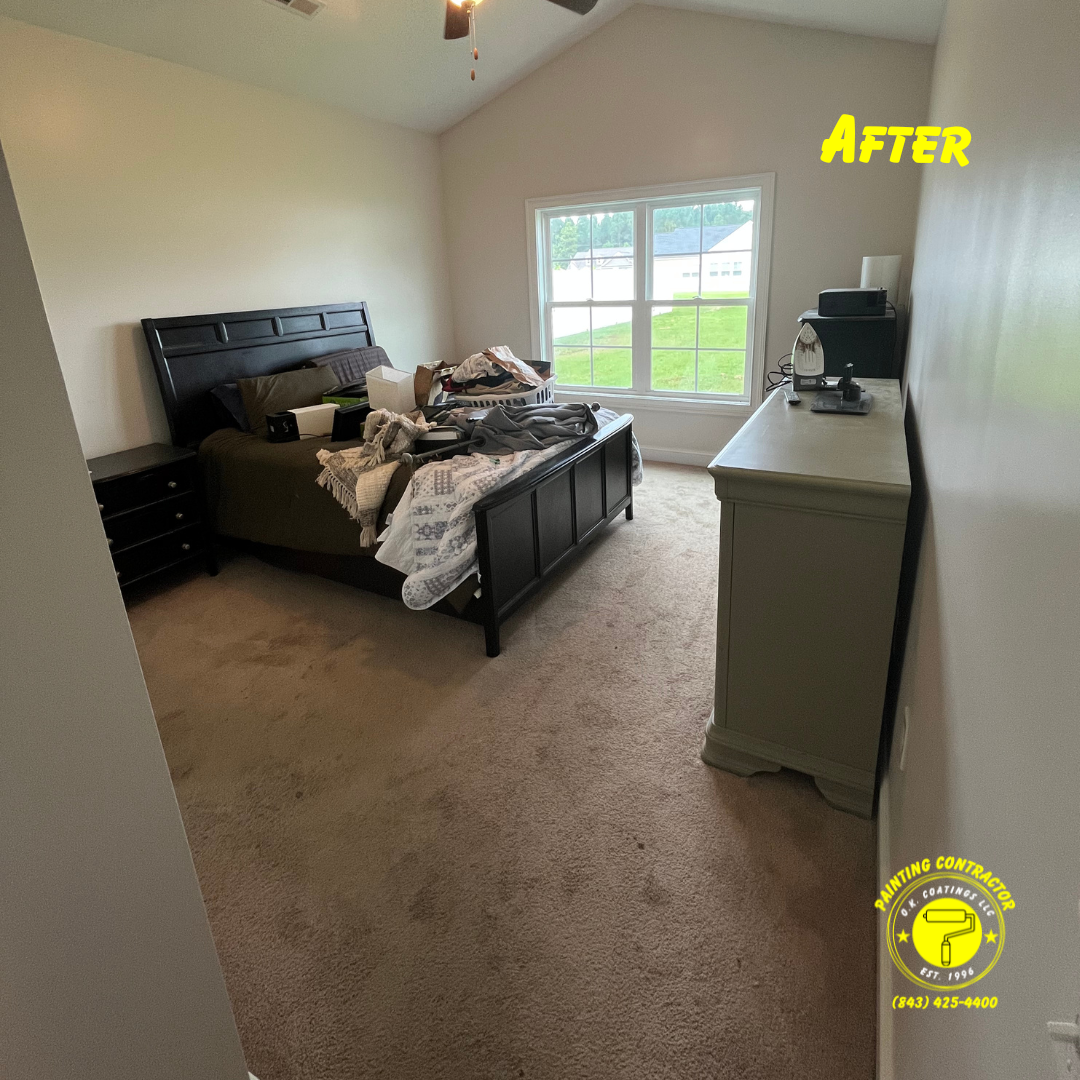 A bedroom with a dark wooden bed and dresser, light-colored walls, and carpet, labeled 