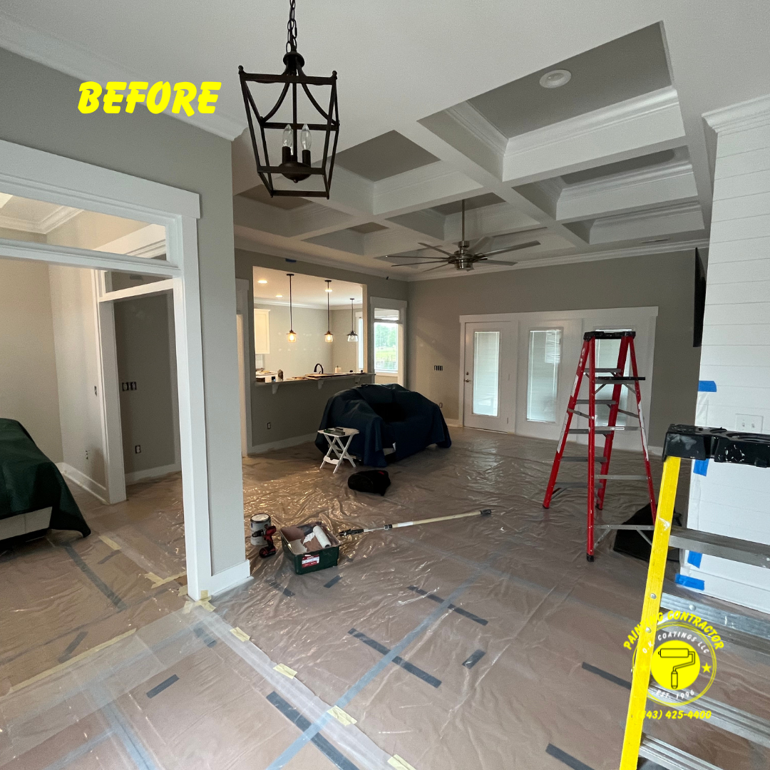 A residential room under renovation with gray walls, a coffered ceiling, plastic floor covering, and a red step ladder.