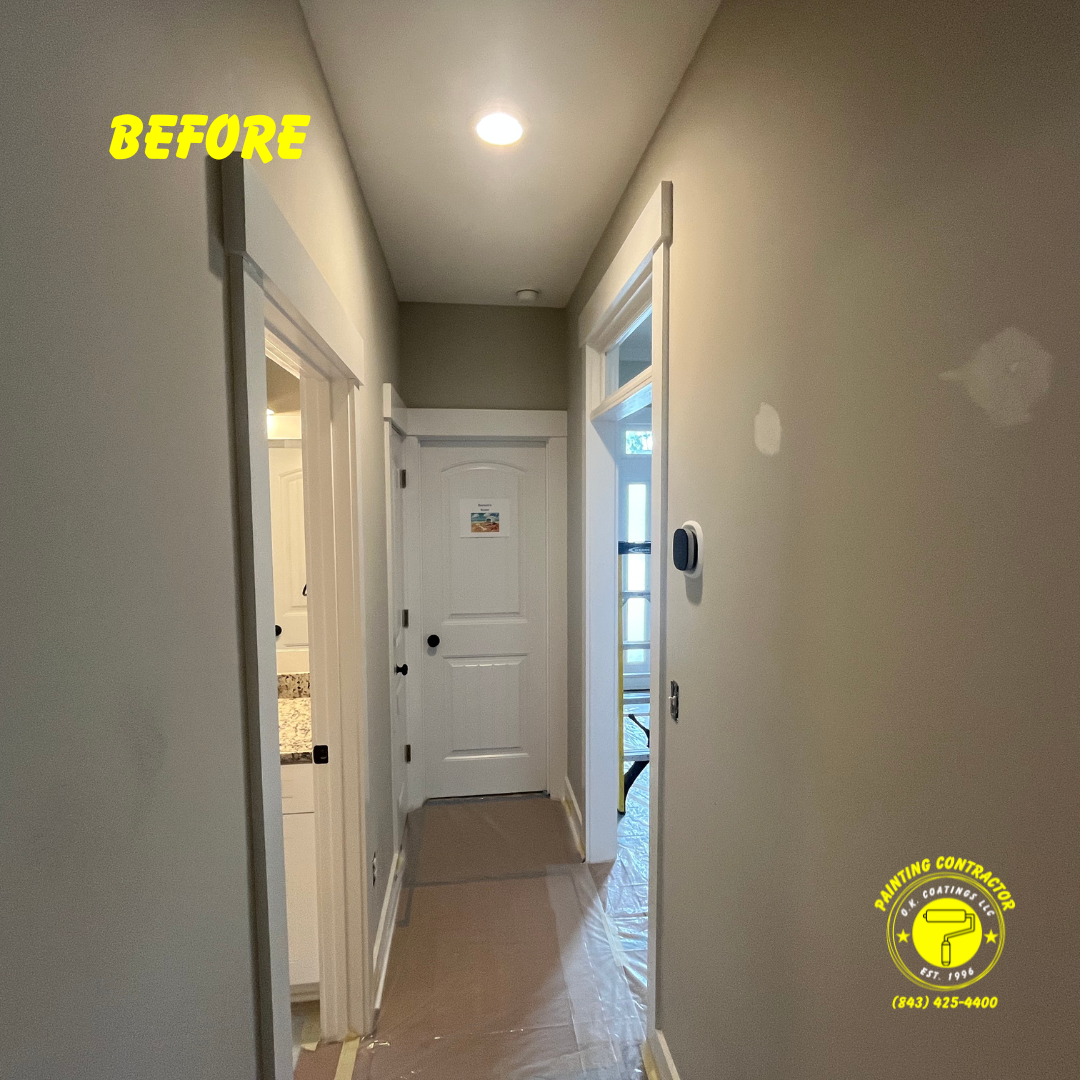 A beige hallway with white door frames and a white door, currently prepared for painting with floor protection.