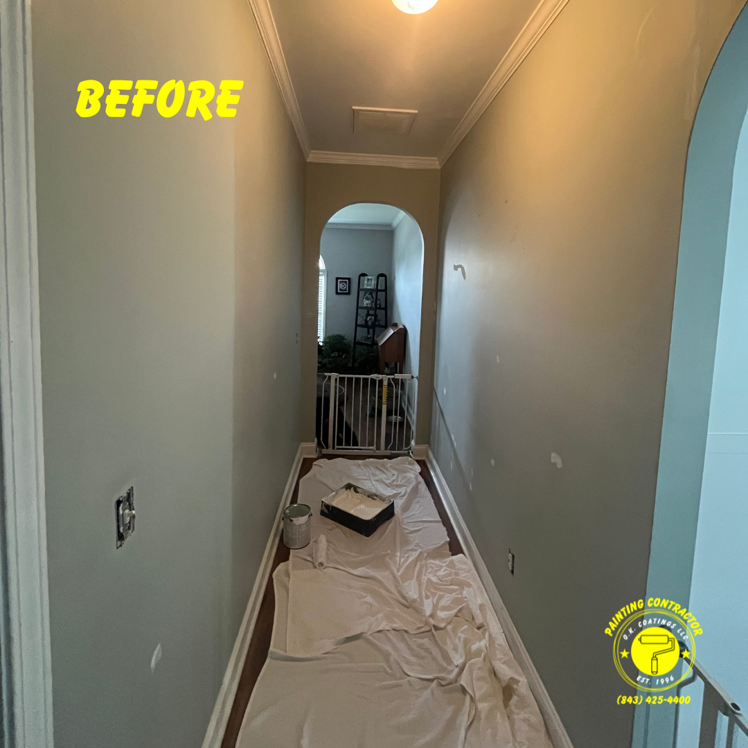 A narrow residential hallway with light gray walls, white trim, and a drop cloth on the floor, marked 