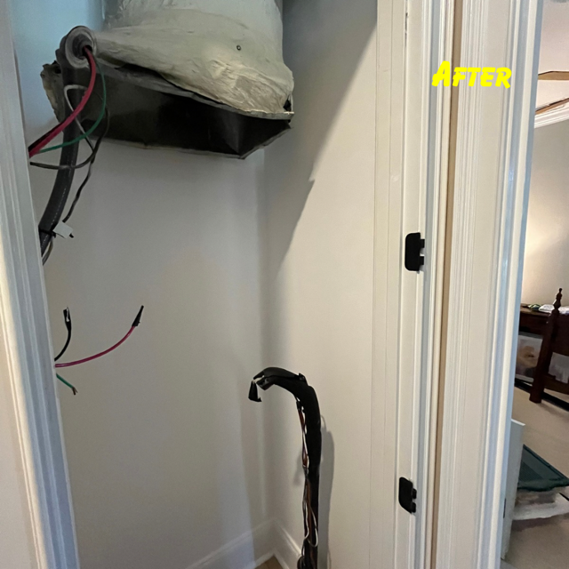 Open interior closet with exposed electrical wiring hanging from the ceiling and a bundle of wires protruding from floor.