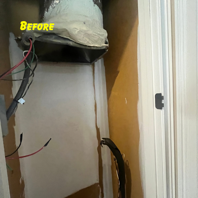 An interior closet space with exposed electrical wiring and a duct opening at the top, marked with the yellow label 
