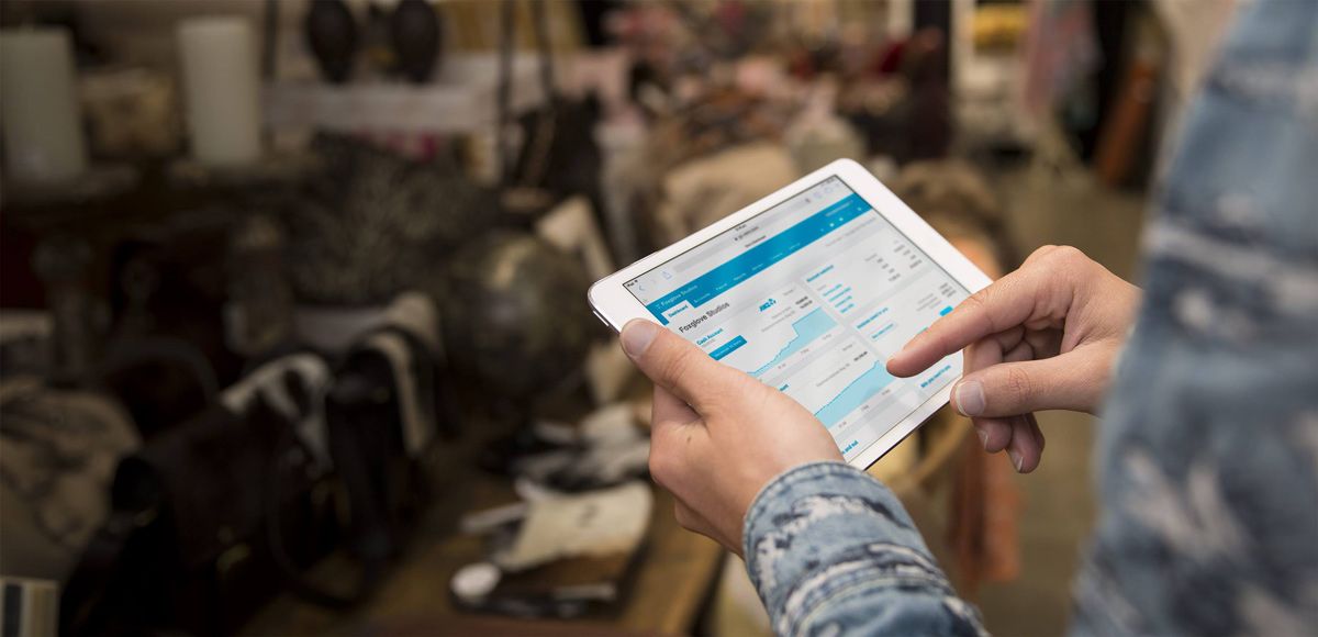 A Person is Holding a Tablet in Their Hands in a Store — Rochdale Accounting & Business Advisory in Alstonville, NSW