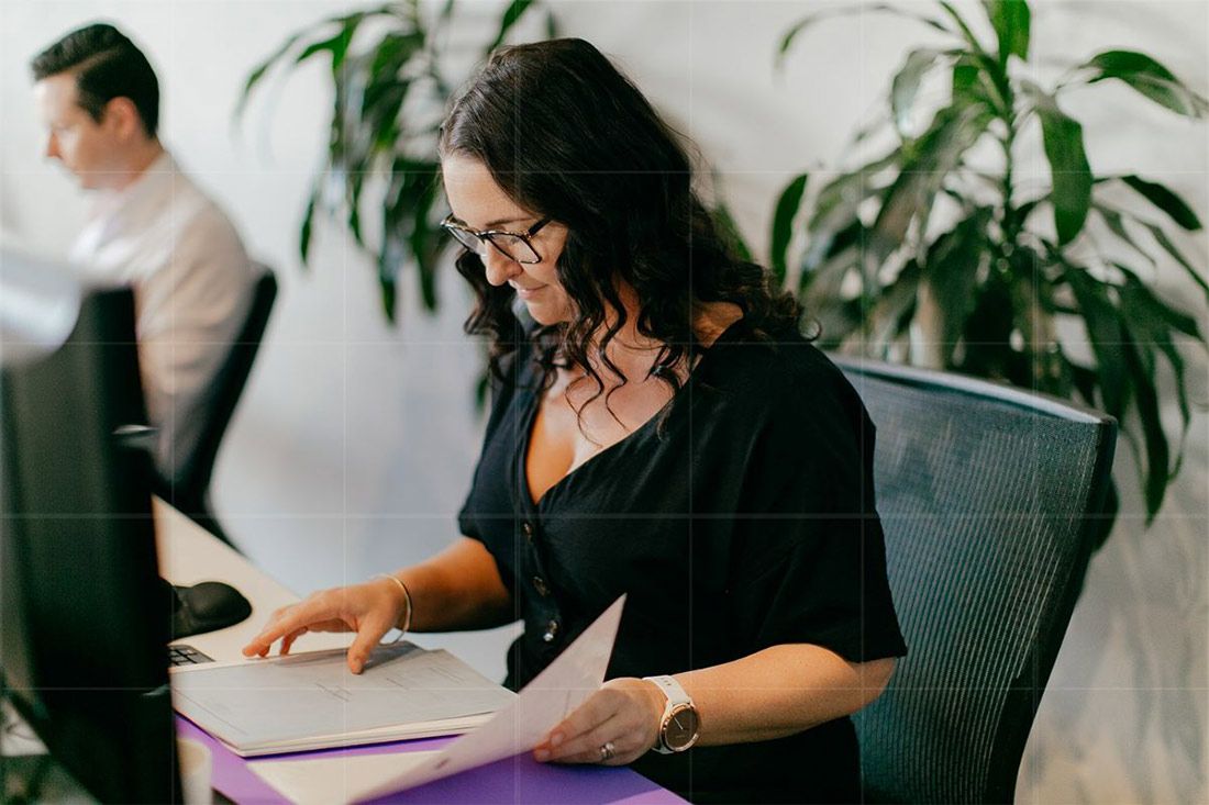 A Woman is Sitting at a Desk in Front of a Computer — Rochdale Accounting & Business Advisory in Alstonville, NSW