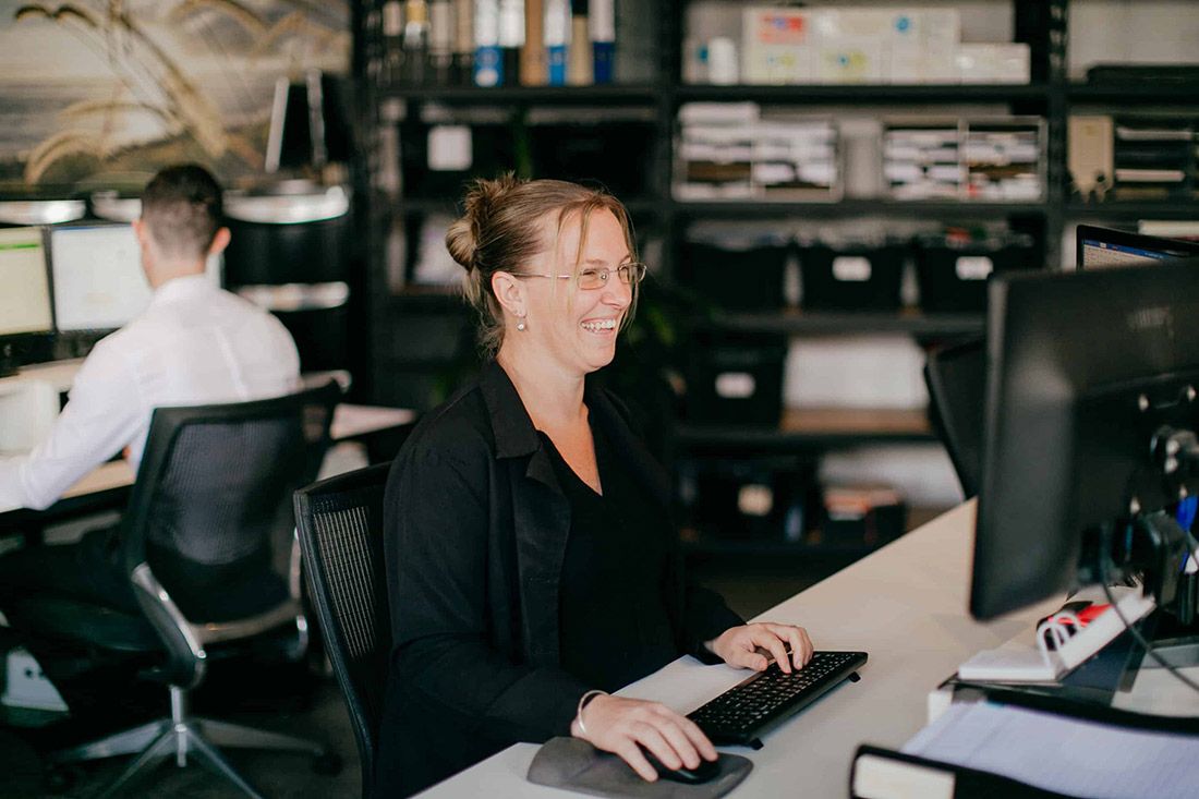A Woman is Sitting at a Desk in Front of a Computer — Rochdale Accounting & Business Advisory in Bangalow, NSW