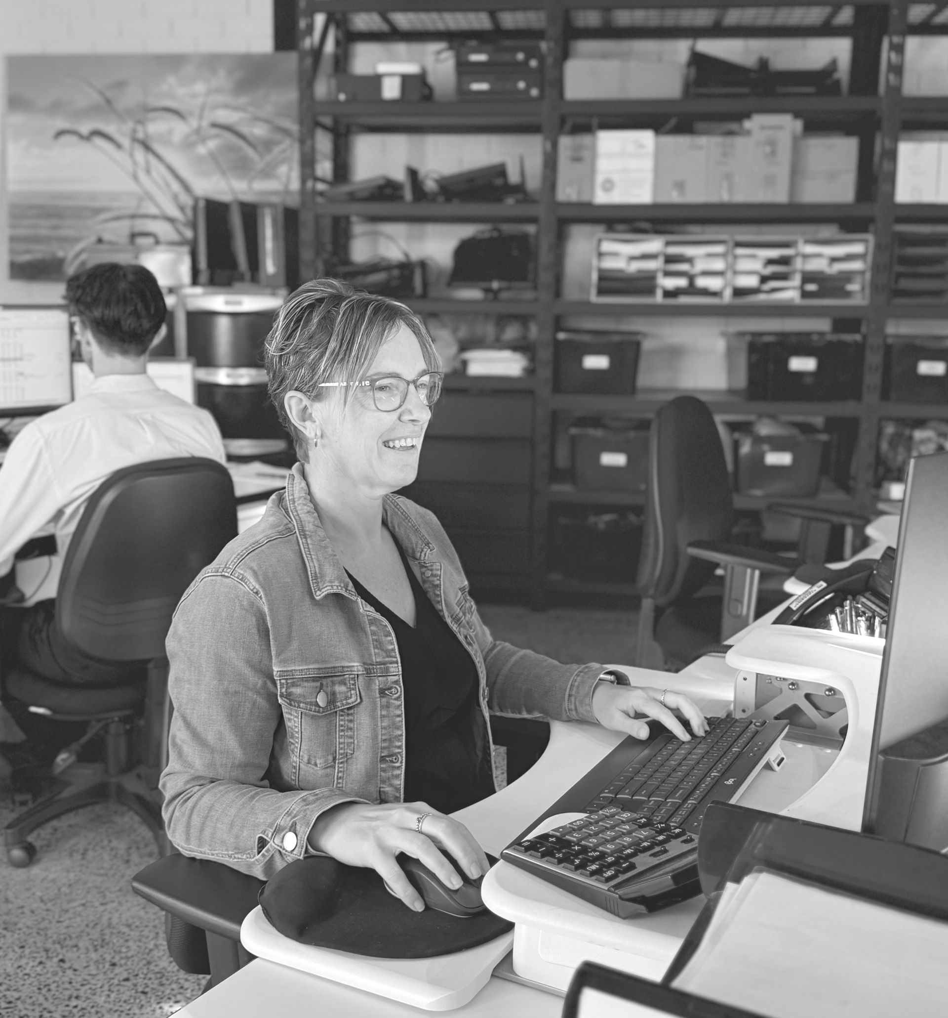 A Woman is Sitting at a Desk in Front of a Computer — Rochdale Accounting & Business Advisory in Alstonville, NSW