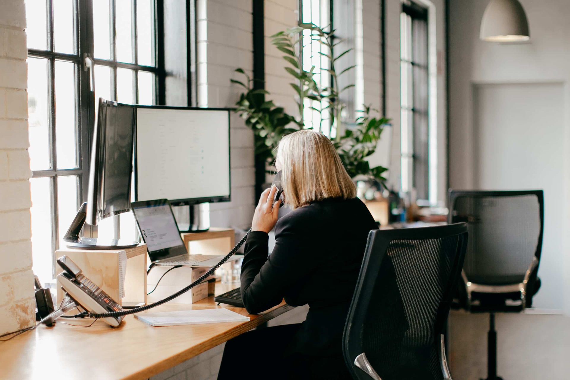 A Group of People Are Sitting at Desks in Front of Computer — Rochdale Accounting & Business Advisory in Alstonville, NSW