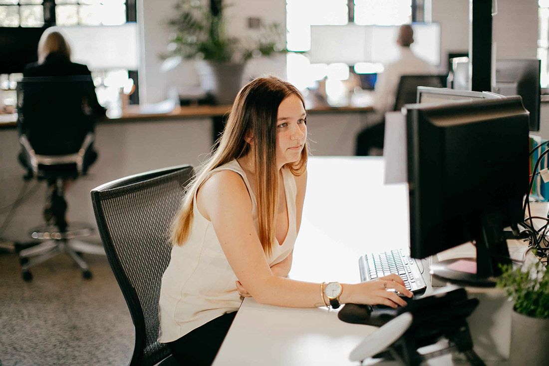 A Woman is Sitting at a Desk in Front of a Computer — Rochdale Accounting & Business Advisory in Alstonville, NSW