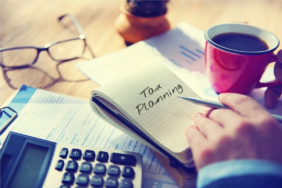 A Person is Writing in a Notebook — Rochdale Accounting & Business Advisory in Alstonville, NSW