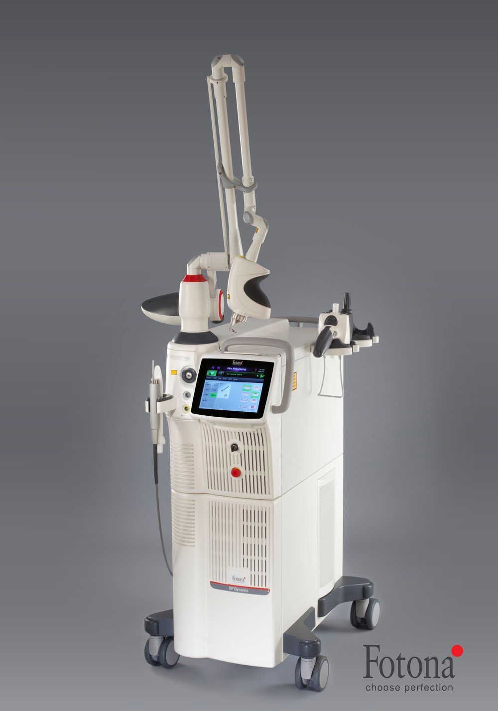 A white machine is sitting on a cart on a gray background.