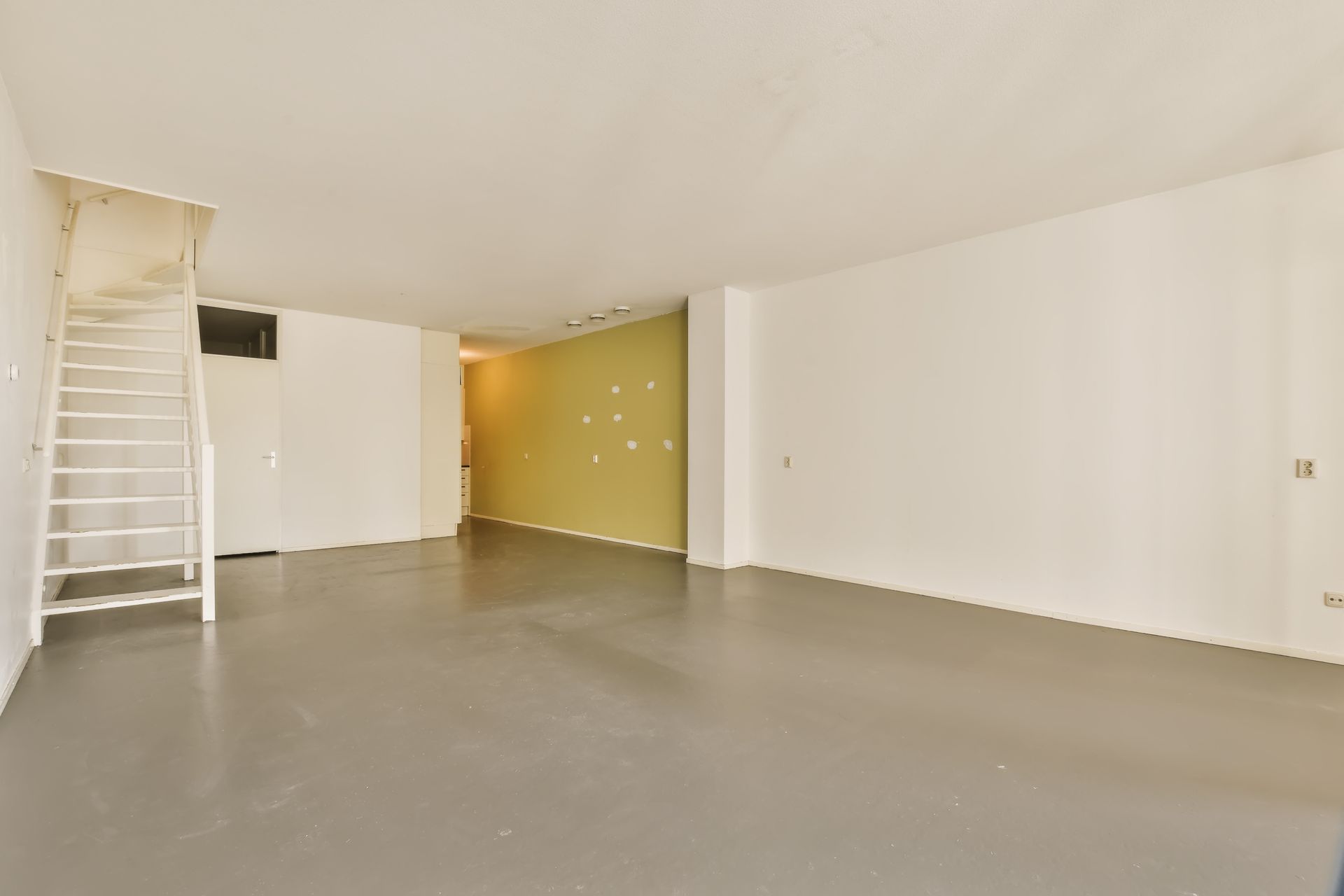 There is a staircase in the middle of the room.