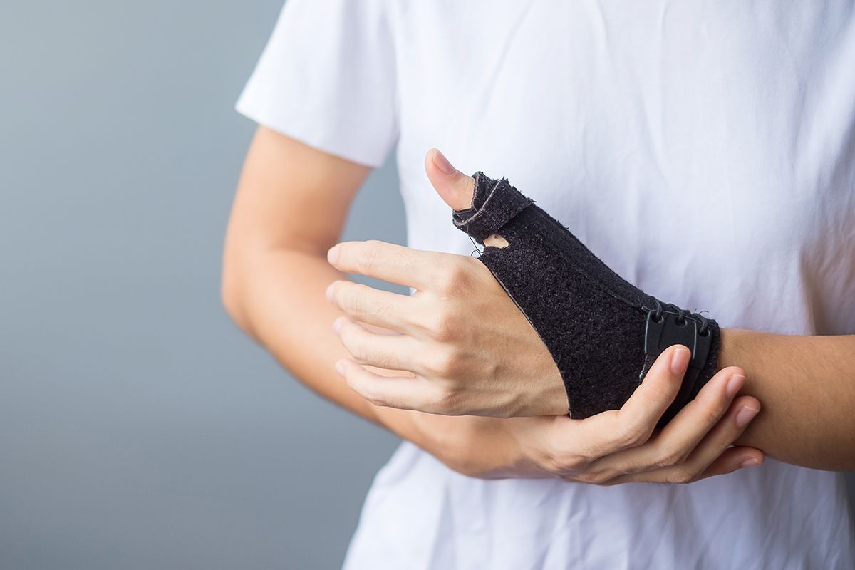 Adult wearing a wrist splint, representing hand and wrist conditions treated in occupational therapy