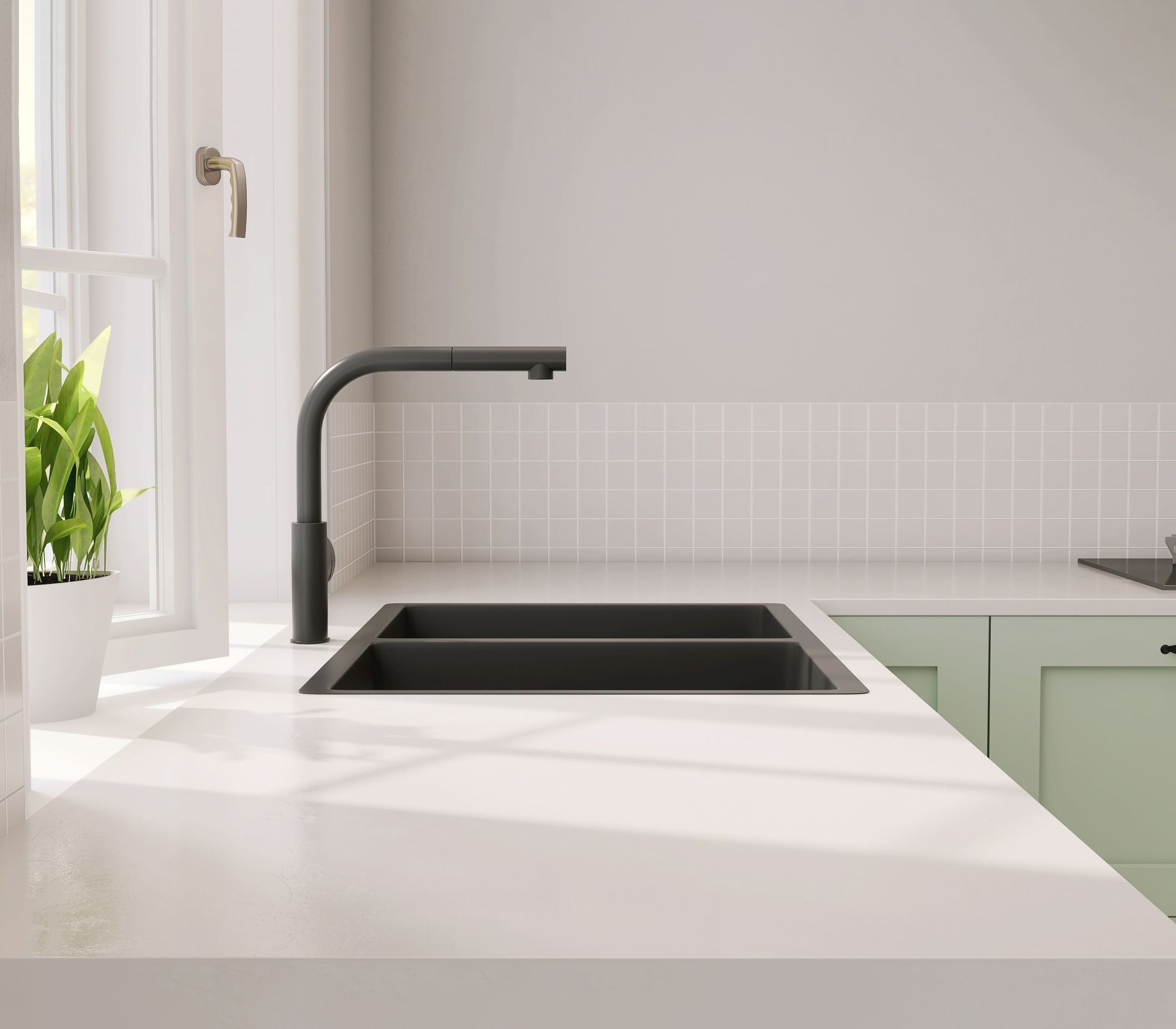 Kitchen sink with a dark faucet, white countertop, and light green cabinets. Kitchen sink with a dark faucet, white countertop, and light green cabinets.