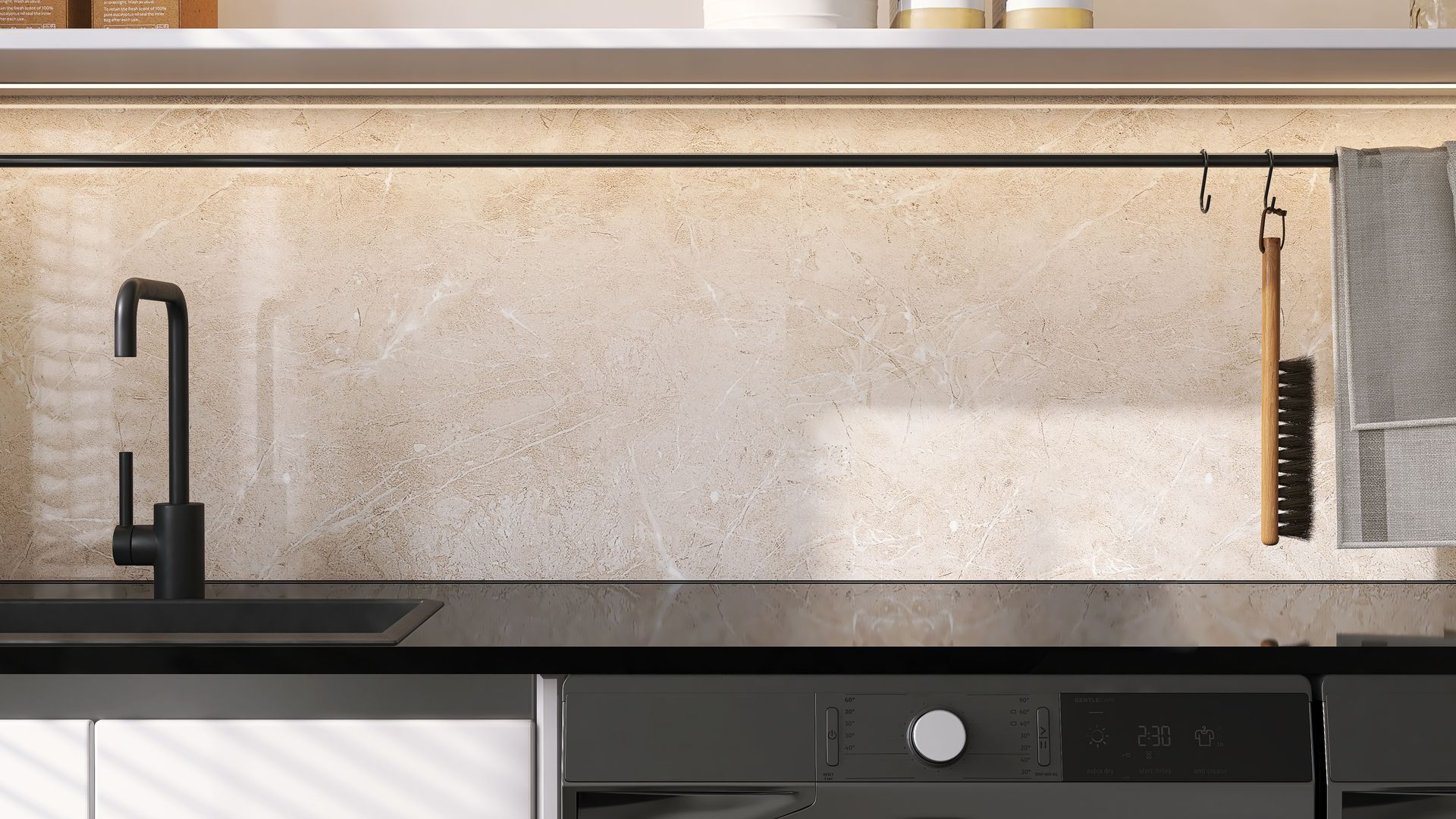 Kitchen countertop with black faucet, oven, and textured backsplash; hooks hold brush and towel. Kitchen countertop with black faucet, oven, and textured backsplash; hooks hold brush and towel.