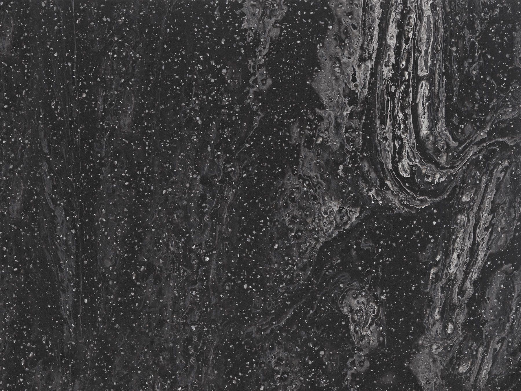 Dark gray stone with flecks and veining.