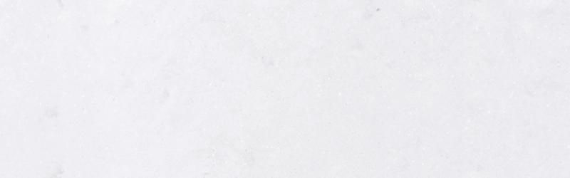 White surface with slight texture and subtle variations in tone.