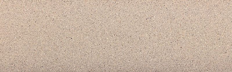 Beige speckled surface with subtle horizontal lines, resembling stone or sand.
