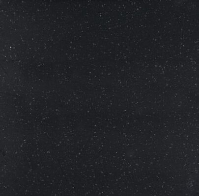 Dark surface speckled with many small, light-colored dots, resembling stars.