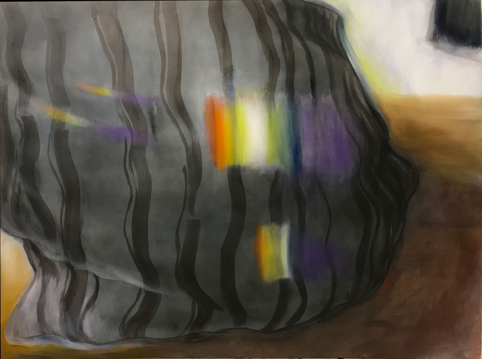 Abstract dark striped object with a few bright colored bands against a brown background