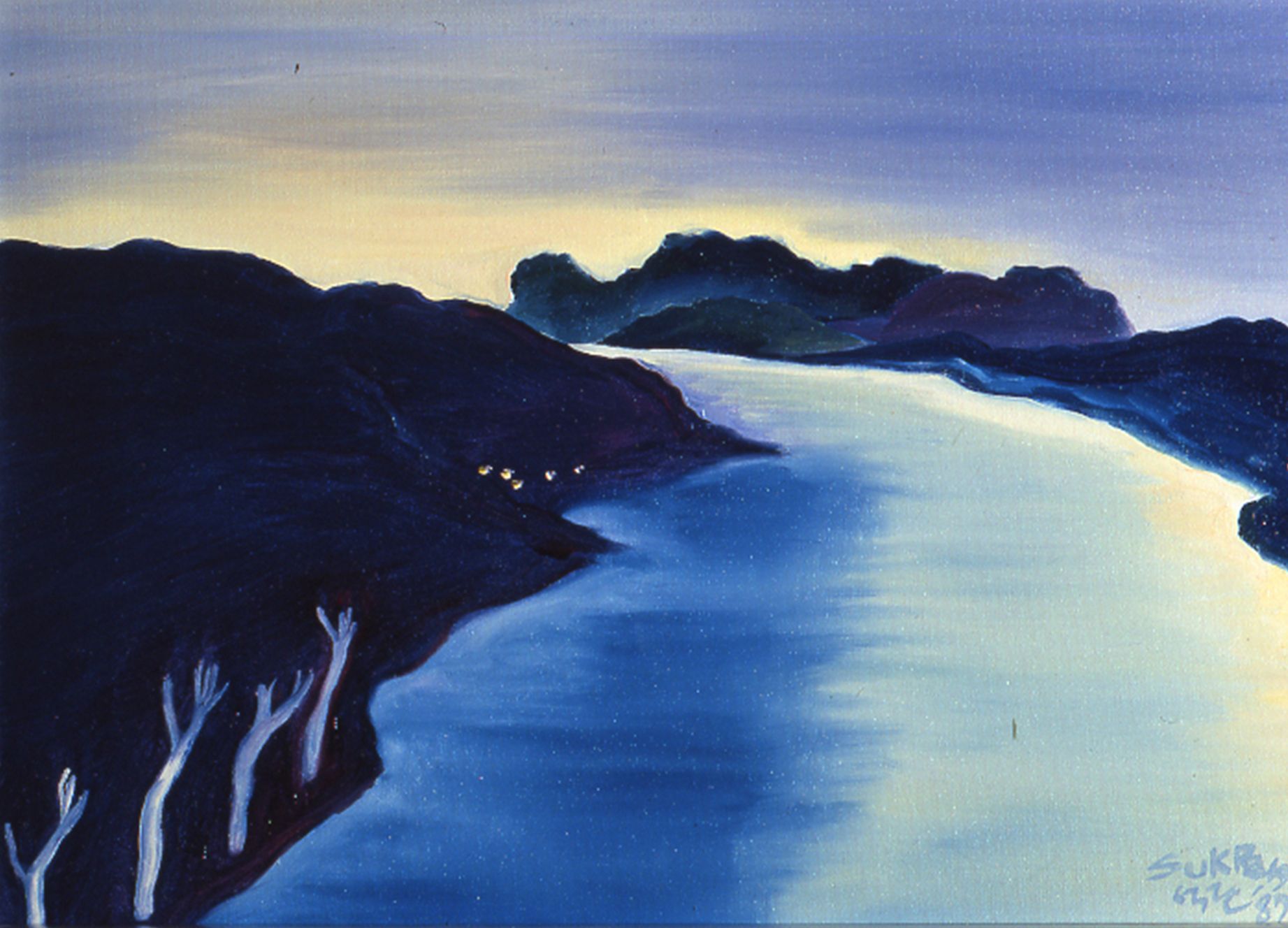 Dark blue coastal landscape with a bright curving bay and distant islands at dusk