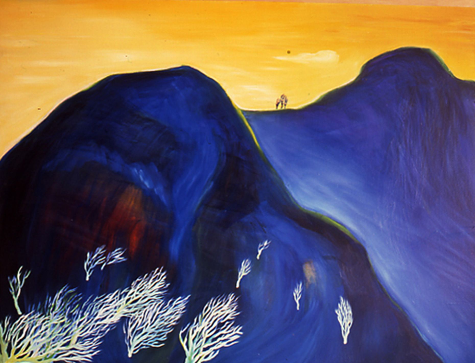 Blue mountains under a golden sky, with white shrubs in the foreground and tiny hikers on a ridge.
