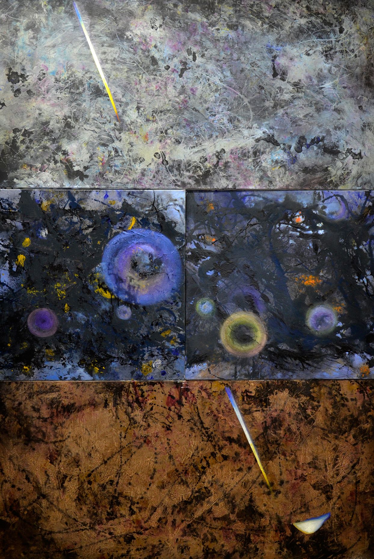 Three abstract textured panels in gray, blue, and rust with scattered circular forms and diagonal white streaks.