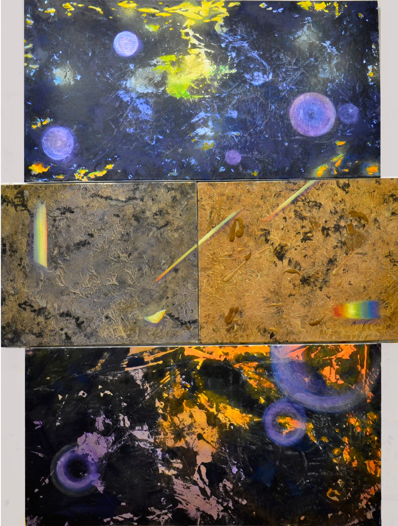 Abstract cosmic-style painting with blue, yellow, and orange splashes on dark and textured panels