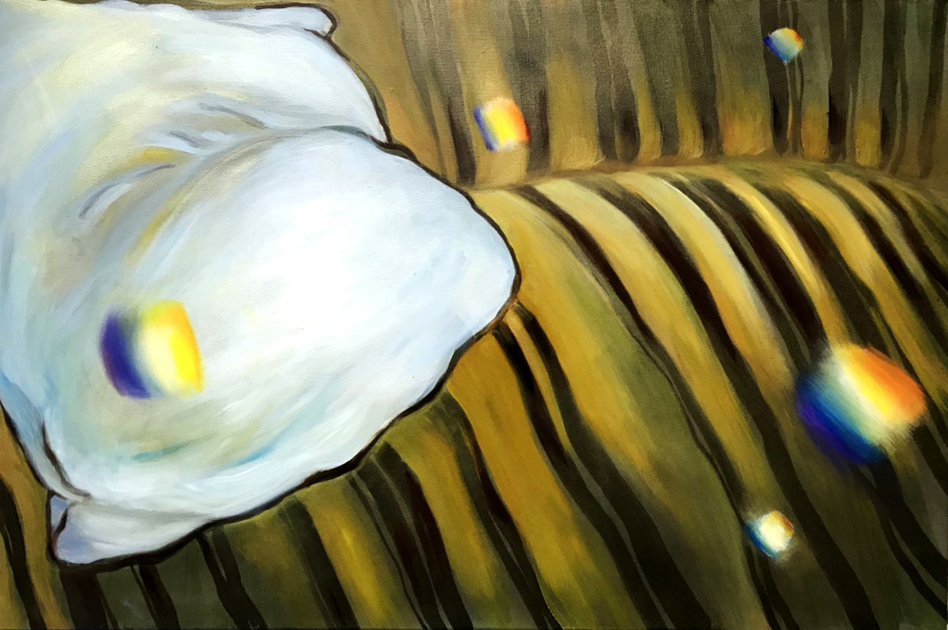 White flower petal on striped striped yellow-brown background with rainbow-like light reflections
