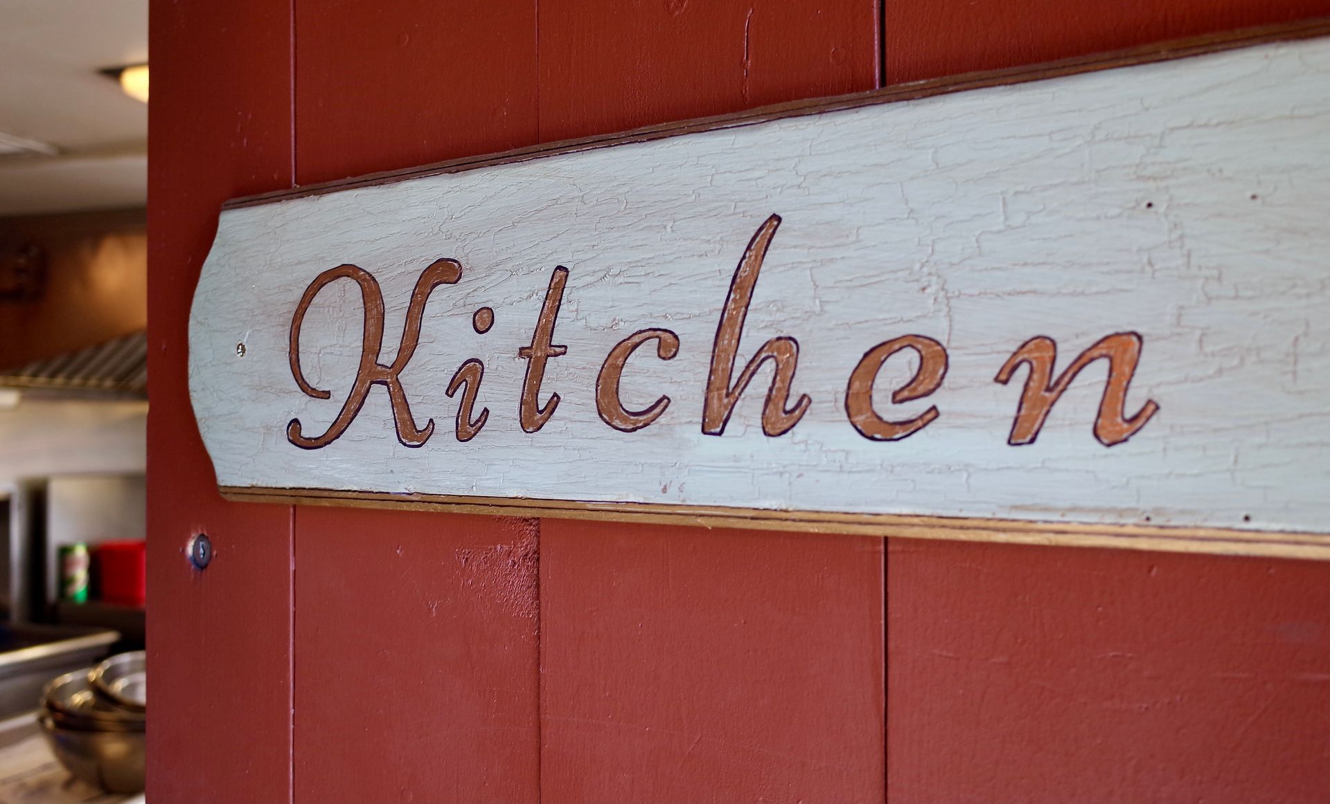 Rustic wooden sign reading 