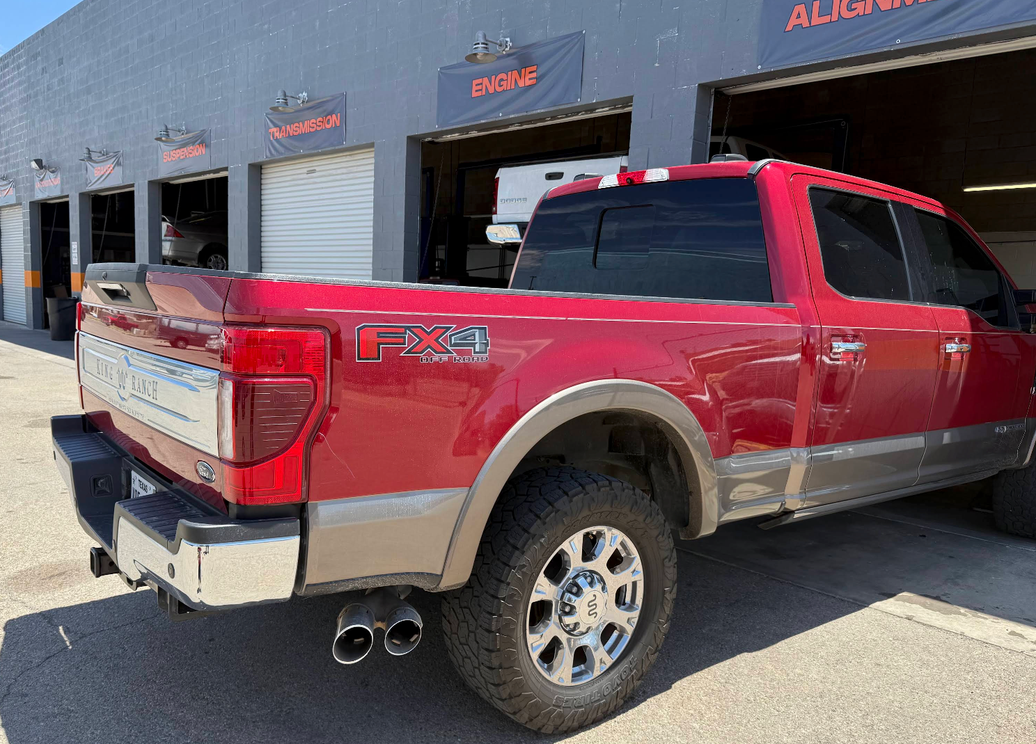 Red and tan pickup truck parked outside an auto repair garage | Super 5 Auto Center