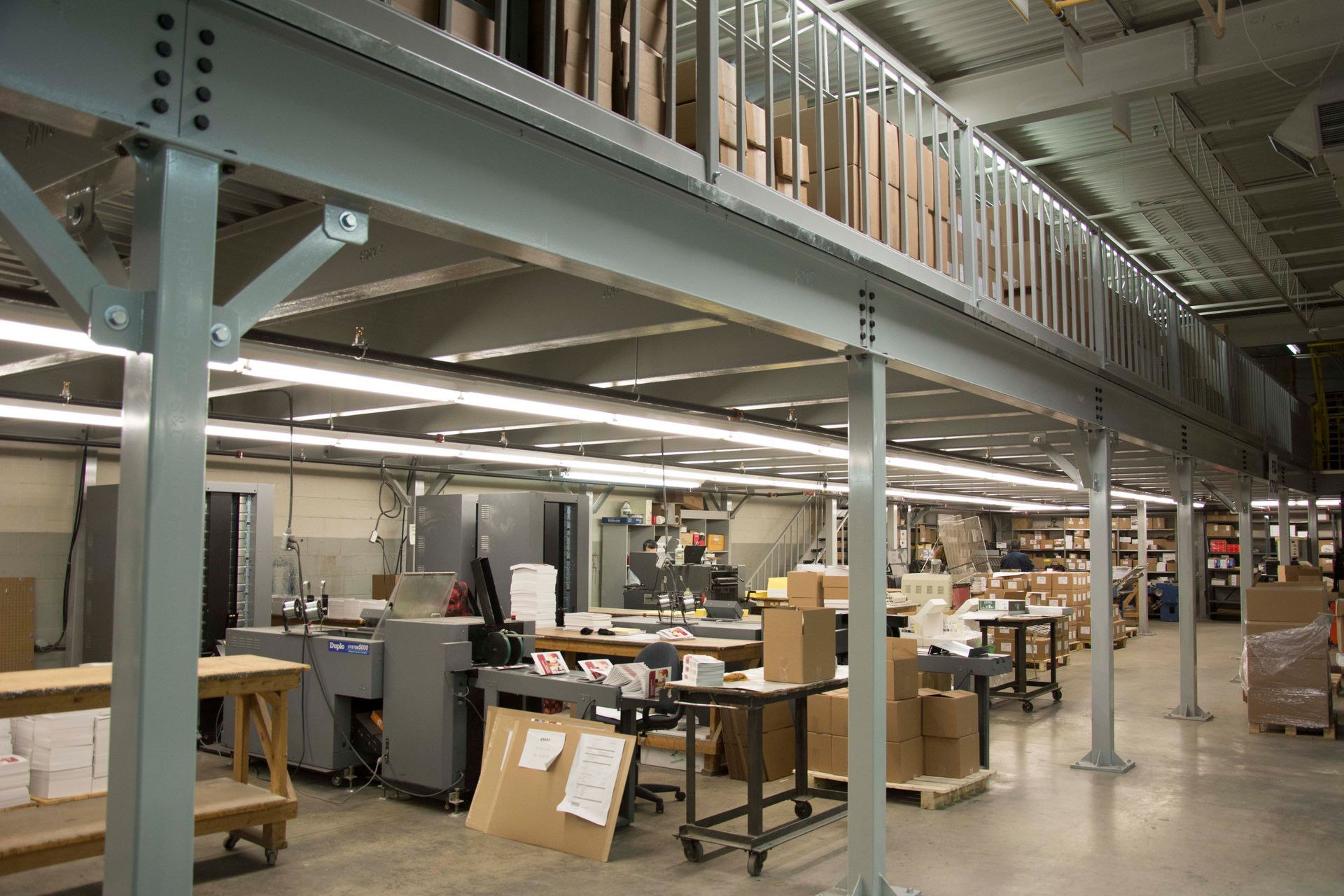 A large warehouse filled with lots of boxes and tables