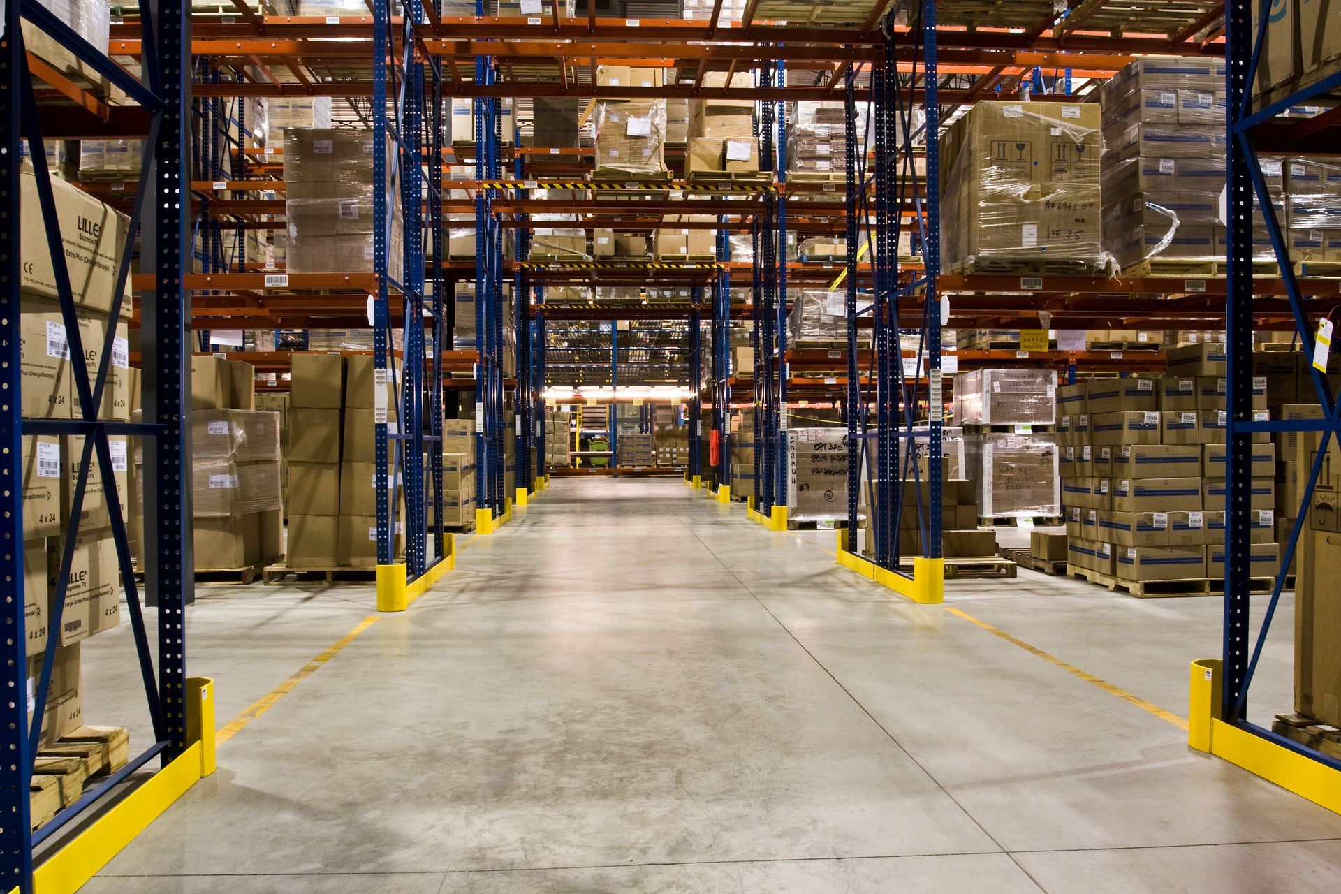A large warehouse filled with lots of boxes and shelves