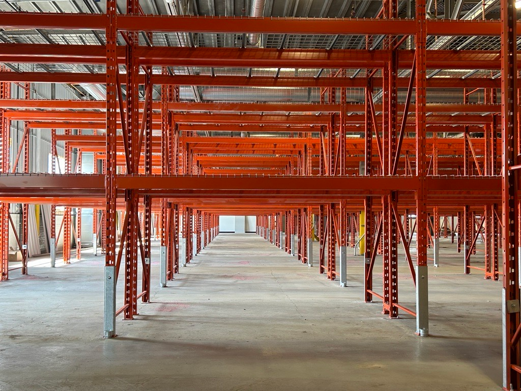 A large warehouse filled with lots of boxes and tables