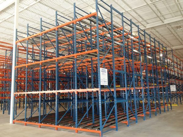 A large warehouse with lots of shelves and racks