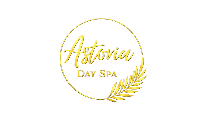 A gold logo for Astovia Day Spa, featuring elegant cursive text and a stylized branch design inside a circular frame.