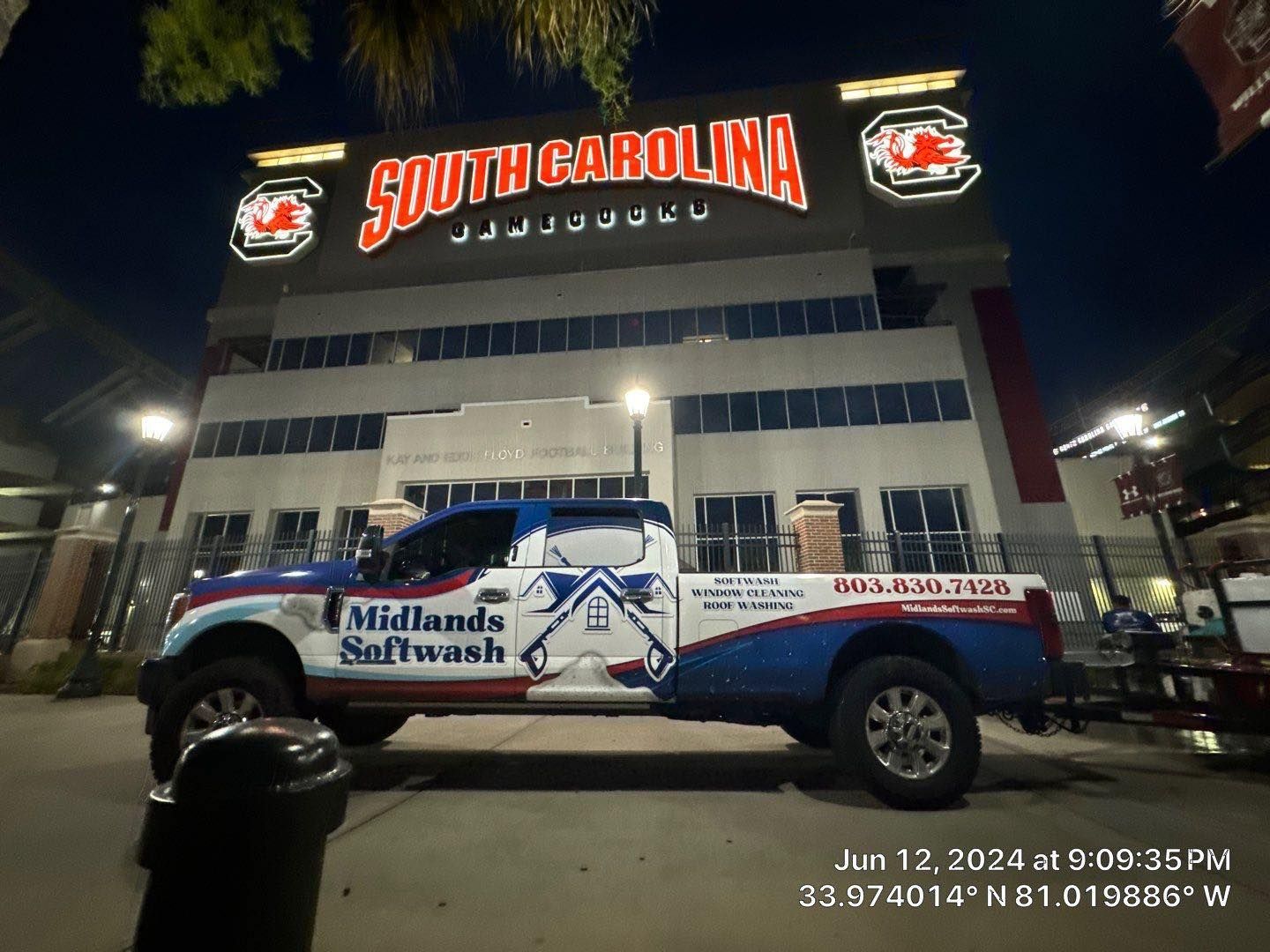 A truck is parked in front of a building that says south carolina