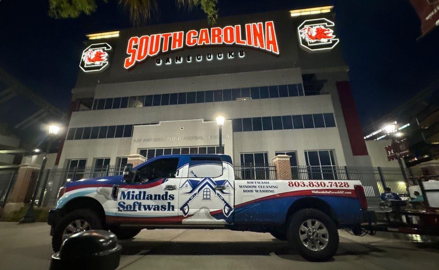 A truck is parked in front of a building that says south carolina